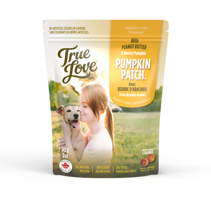 Bag of True Love dog treats with a girl hugging her dog on the front. Pumpkin Patch flavour - peanut butter and harvest pumpkin.